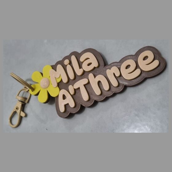 Papan nama Mila A'Three warna coklat dan krem